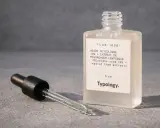 Flacon de sérum Typology Acide Glycolique 10%. La question "peut on mélanger acide glycolique et acide hyaluronique" est au cœur des routines de soins.