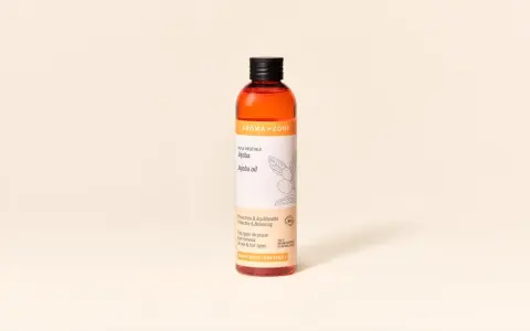 Flacon d'huile de jojoba Aroma-Zone, aux multiples bienfaits pour la peau et les cheveux.