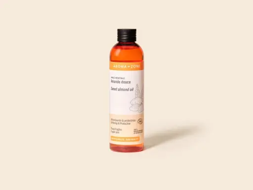 Bouteille d'huile d'amande douce Aroma-Zone, idéale pour peaux fragiles. L'huile d'amande douce inconvénient est rare, mais une allergie est possible.