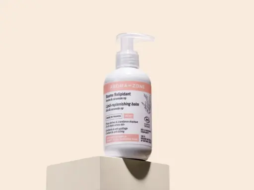 Flacon de baume relipidant Aroma-Zone, pour peaux sèches et atopiques. Sa formule est vegan et certifiée bio.