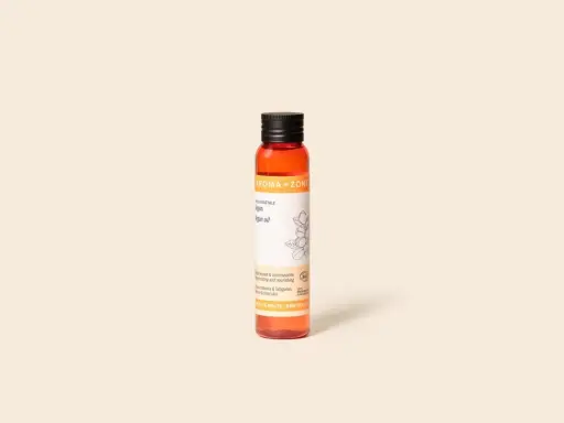 Flacon d'huile d'argan Aroma-Zone. Bien que ses effets secondaires soient rares, cette huile est réputée pour ses bienfaits régénérants et nourrissants.