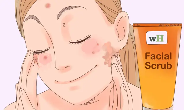 Une jeune femme applique un gommage facial pour savoir comment enlever les boutons sur le visage en une nuit.
