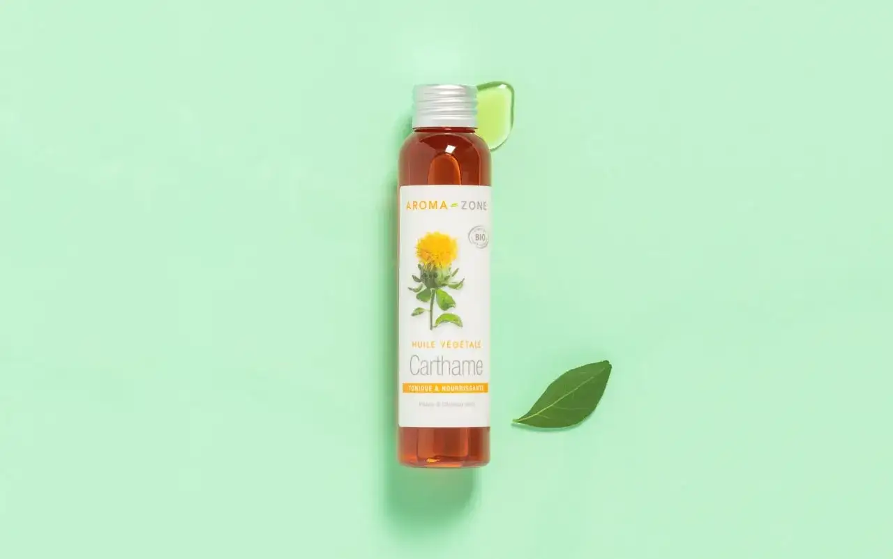 Flacon d'huile végétale de Carthame Aroma-Zone. Bien que bénéfique, l'huile de carthame danger potentiel est à considérer pour les peaux sensibles.